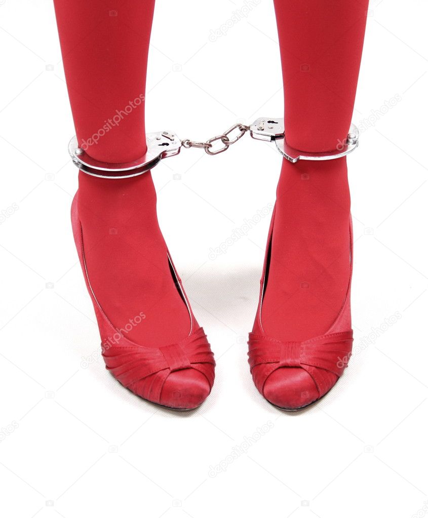 Women legs in handcuffs