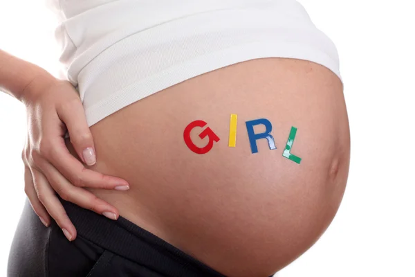 Ordet flicka på mage gravid. det blir en flicka! — Stockfoto