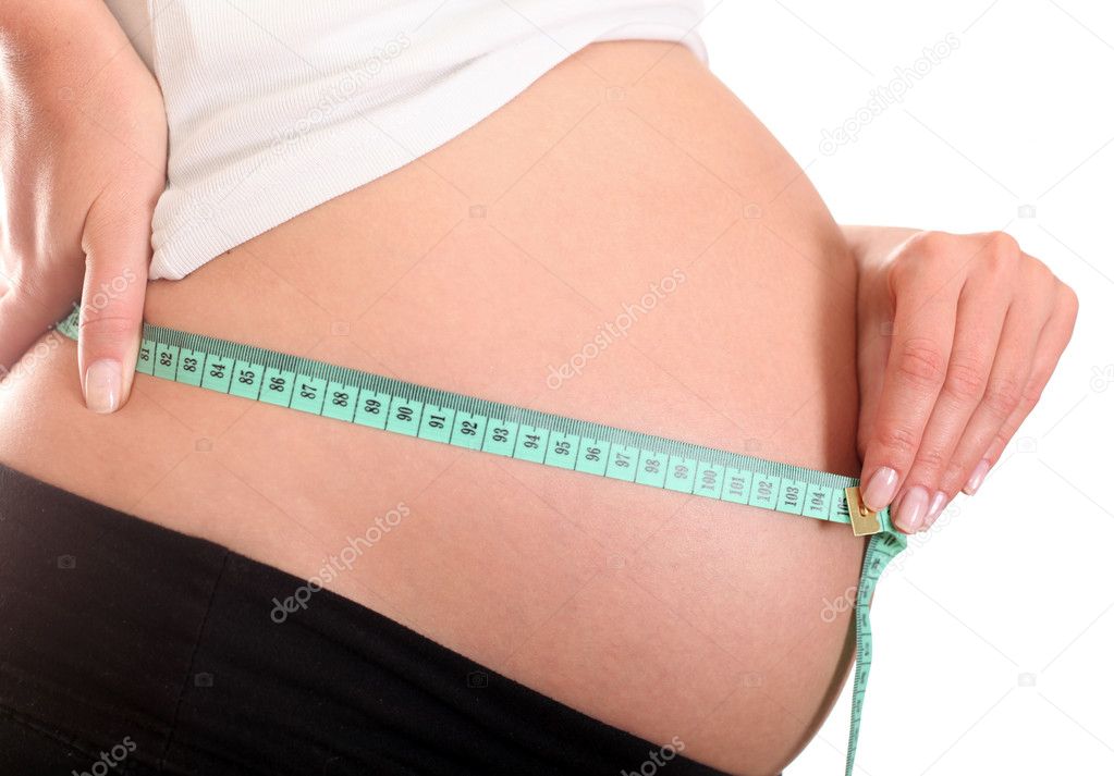 Pregnant Belly and Measuring Tape