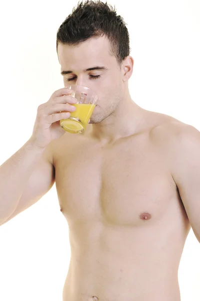 Молодий спортсмен сушить апельсиновий сік — стокове фото