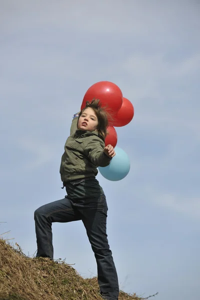 Girl with balloons outdoor — Stock Photo, Image