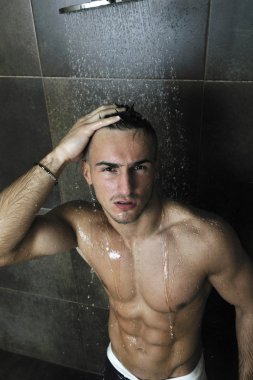 Good looking man under man shower clipart