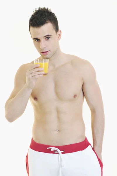 Jovem atleta dringing suco de laranja — Fotografia de Stock