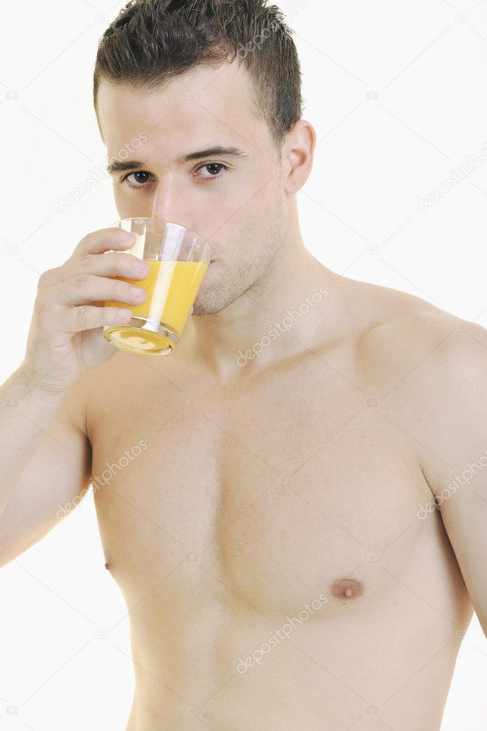 Young athlete dringing orange juice