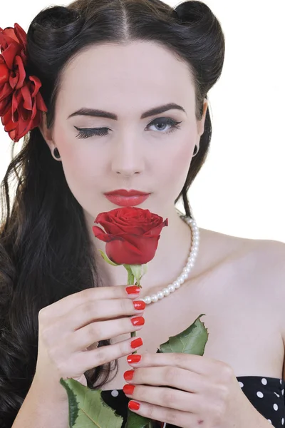 Jonge vrouw met roze bloem geïsoleerd op wit — Stockfoto