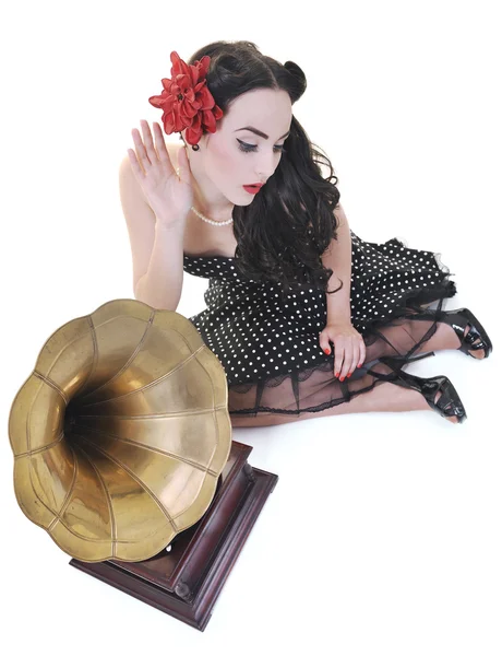 Pretty girl listening music on old gramophone — Stock Photo, Image