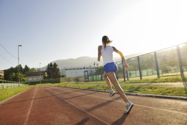 Woman jogging at early morning clipart