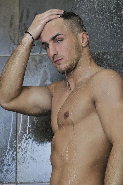 Good looking man under man shower — Stock Photo, Image