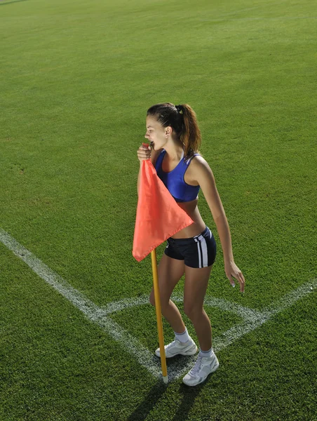 Young woman on corner of soccer stadium — Stock Photo, Image