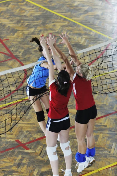 Girls playing volleyball indoor game — Stock Photo, Image