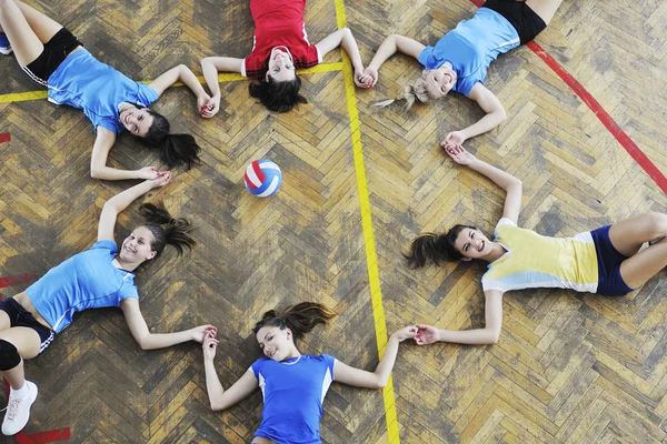 Girls playing volleyball indoor game — Stock Photo, Image