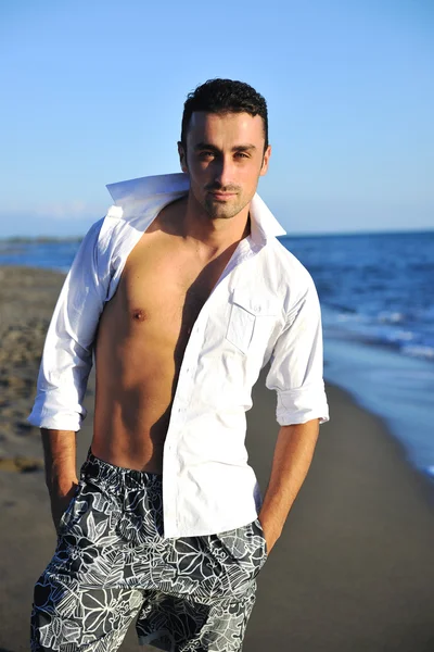 Young man at beach — Stock Photo, Image