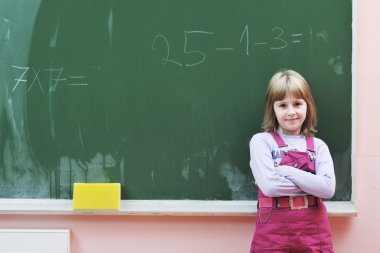 Happy school girl on math classes clipart