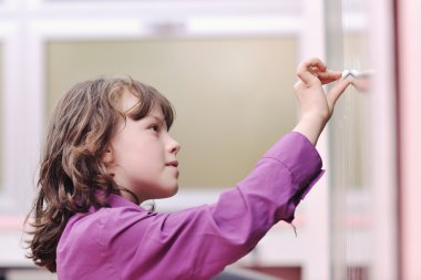 Happy school girl on math classes clipart