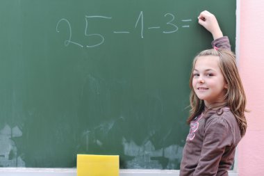 Happy school girl on math classes clipart