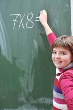 Happy school girl on math classes clipart