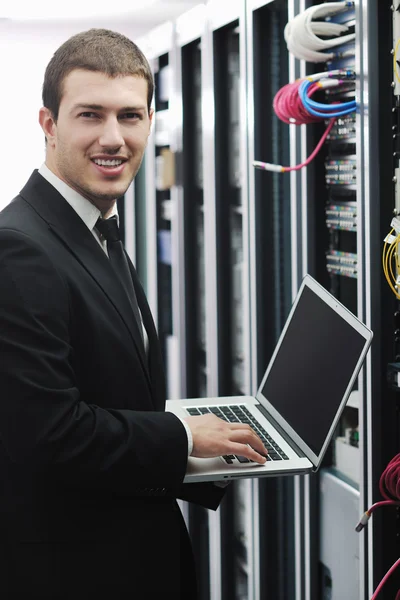 Young handsome business man it engineer in datacenter server room — Stock Photo, Image