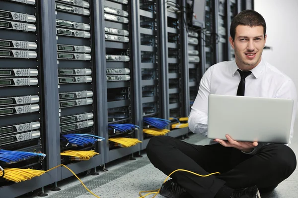 Young handsome business man it engineer in datacenter server room — Stock Photo, Image