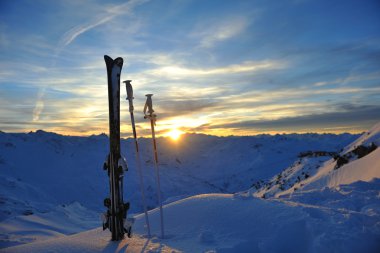 Mountain snow fresh sunset at ski resort in france val thorens clipart