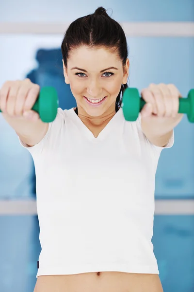 Womanworkout in fitness club on running track machine — Stock Photo, Image