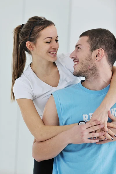 Happy young couple fitness workout and fun — Stock Photo, Image
