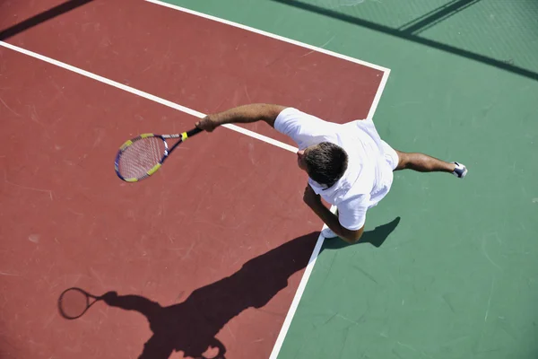 Young man play tennis outdoor — Stock Photo, Image