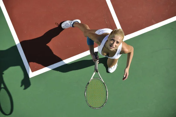 Young woman play tennis outdoor — Stock Photo, Image