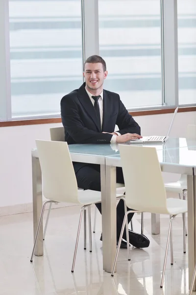 Young business man alone in conference room — Stock Photo, Image