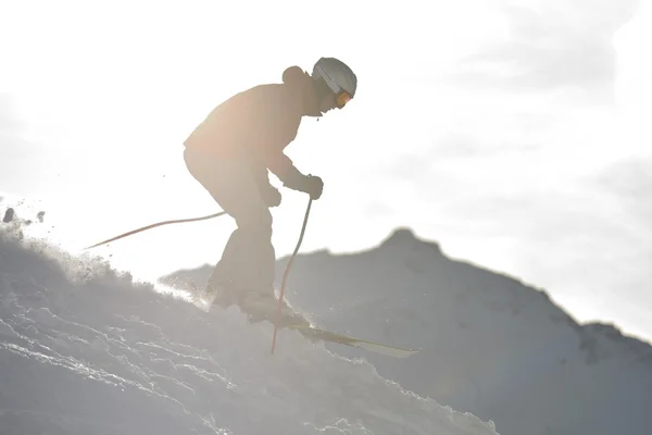 Skiing on on now at winter season — Stock Photo, Image