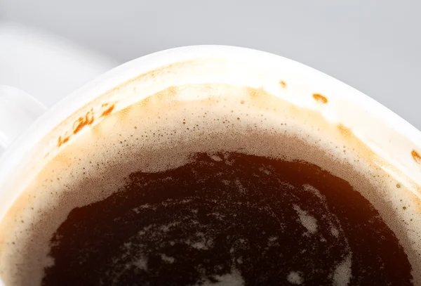 Close-up cup of coffee with foam — Stock Photo, Image