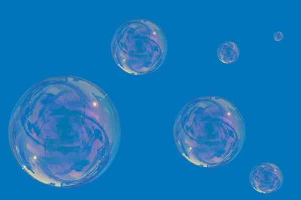 Molte bolle di sapone sopra un cielo blu — Foto Stock