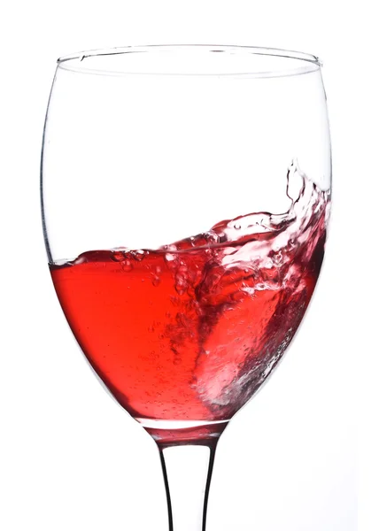 Salpicadura en vaso con vino tinto — Foto de Stock
