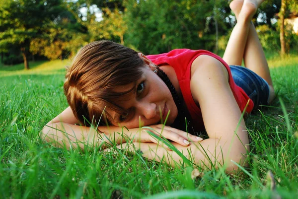 Girl in green grass — Stock Photo, Image