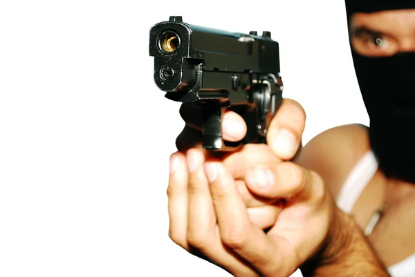 Mannen håller upp en pistol — Stockfoto