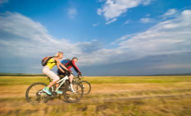 Cyclists in motion clipart