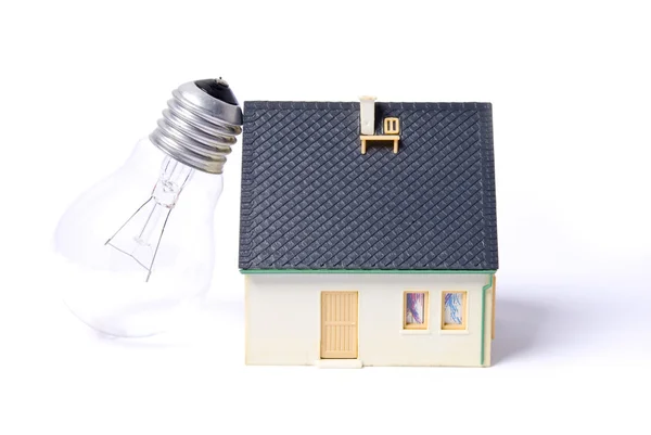 Casa com lâmpada — Fotografia de Stock