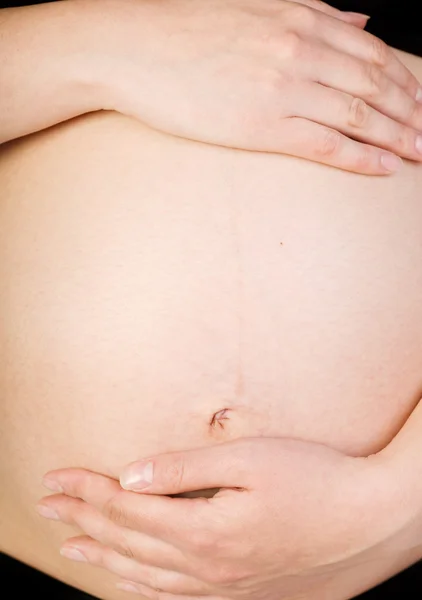 Mid section closeup of a pregnant woman — Stock Photo, Image