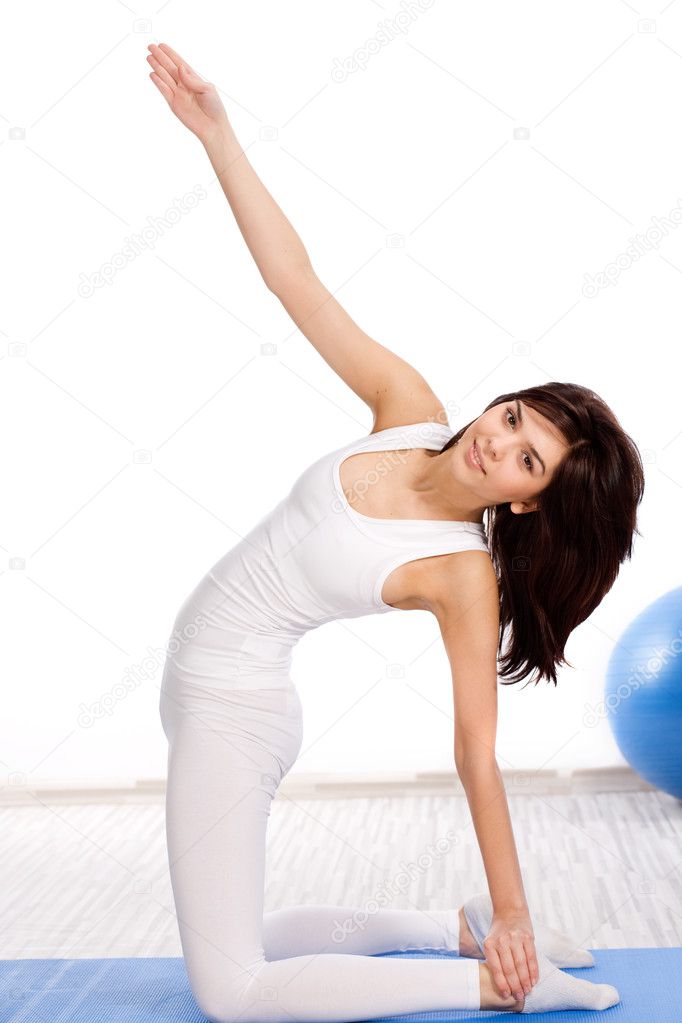 Young beautiful woman in yoga position