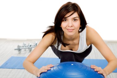 Woman doing fitness exercise clipart