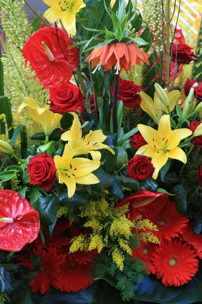 Red and yellow floral arrangement — Stock Photo, Image