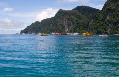 Boats on islands bay Phi Phi Thailand clipart