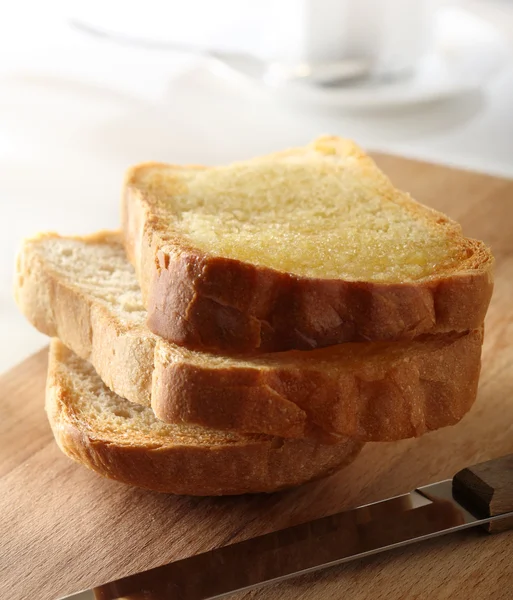 Bread roasted with knife — Stock Photo, Image