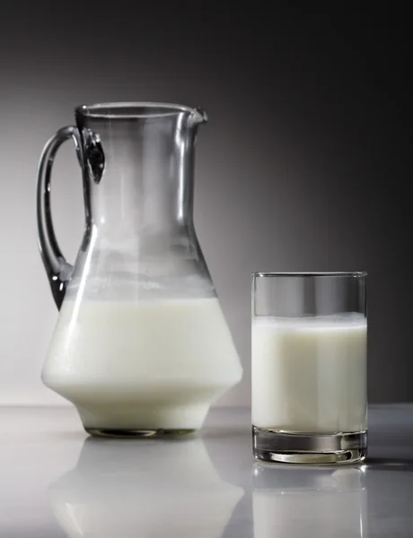 Milk on gray background — Stock Photo, Image