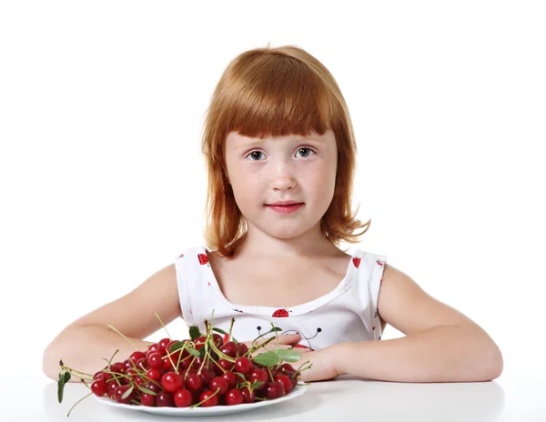 Little girl with cherry Stock Picture