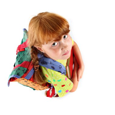 Little girl with backpack looking at camera clipart