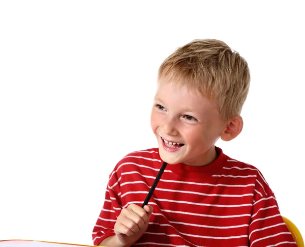 Щасливий маленький хлопчик з олівцем — стокове фото