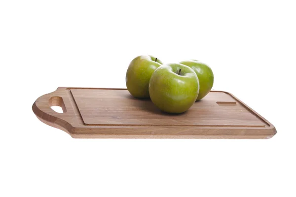 Яблуко на обробній дошці Стокова Картинка