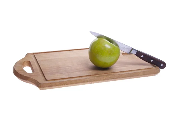 苹果在菜板上 免版税图库图片
