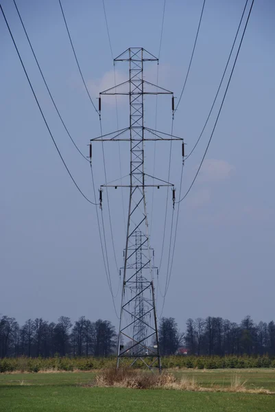 High voltage mast on field — Stock Photo, Image
