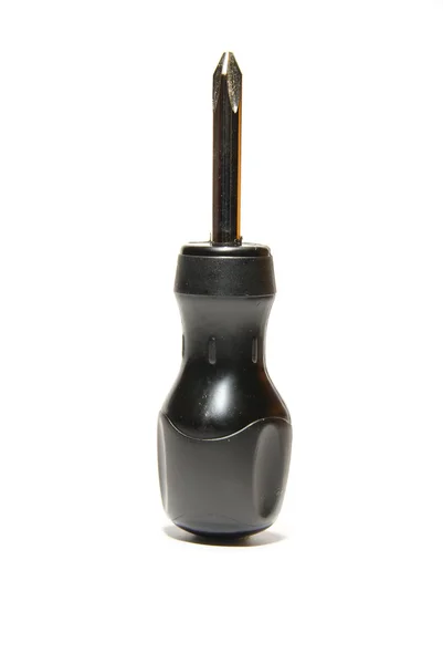 Small, black screwdriver on white — Stock Photo, Image